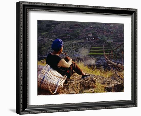 Smoking Her Pipe, a Naxi Woman Rests after Crossing a Precarious Pipe Bridge High Above the Yangtse-Amar Grover-Framed Photographic Print