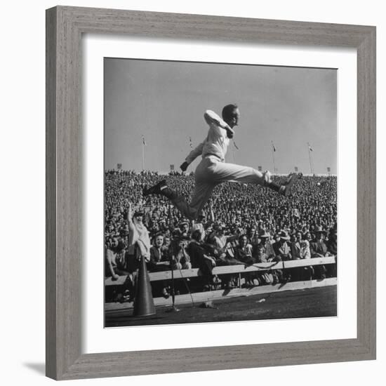 Smu Cheerleader Leaping High into Air at University of Texas Football Game-Loomis Dean-Framed Photographic Print