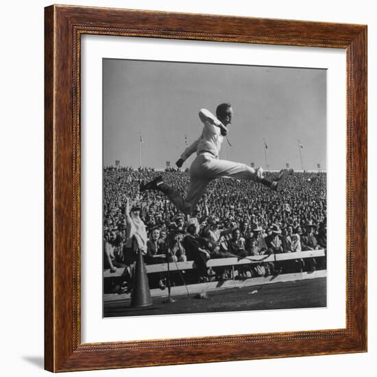 Smu Cheerleader Leaping High into Air at University of Texas Football Game-Loomis Dean-Framed Photographic Print