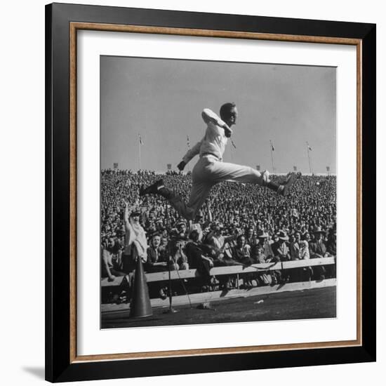 Smu Cheerleader Leaping High into Air at University of Texas Football Game-Loomis Dean-Framed Photographic Print