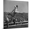Smu Cheerleader Leaping High into Air at University of Texas Football Game-Loomis Dean-Mounted Photographic Print