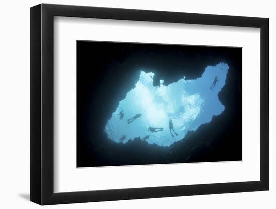 Snorkelers Swim Above a Blue Hole on Palau's Barrier Reef-Stocktrek Images-Framed Photographic Print