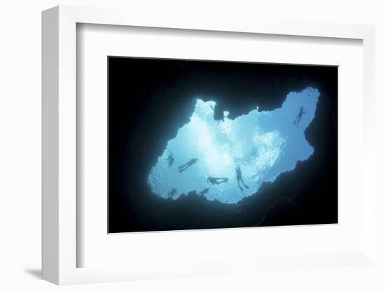 Snorkelers Swim Above a Blue Hole on Palau's Barrier Reef-Stocktrek Images-Framed Photographic Print
