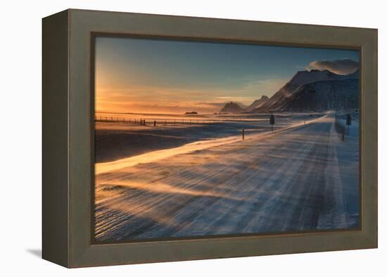 Snow Blows across an Icelandic Road at Sunrise with Mountains Looming in the Distance-Alex Saberi-Framed Premier Image Canvas