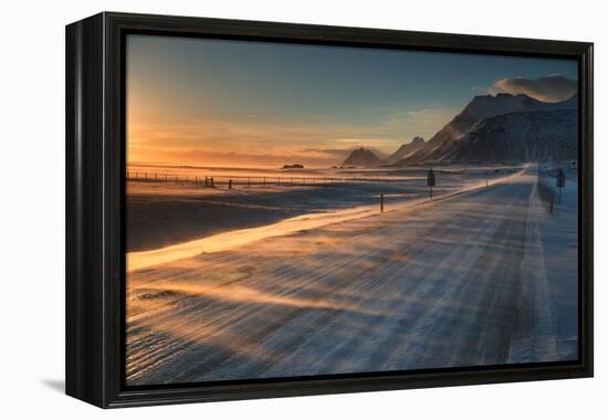 Snow Blows across an Icelandic Road at Sunrise with Mountains Looming in the Distance-Alex Saberi-Framed Premier Image Canvas