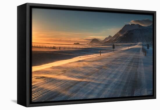 Snow Blows across an Icelandic Road at Sunrise with Mountains Looming in the Distance-Alex Saberi-Framed Premier Image Canvas