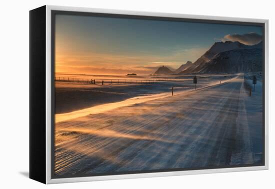 Snow Blows across an Icelandic Road at Sunrise with Mountains Looming in the Distance-Alex Saberi-Framed Premier Image Canvas