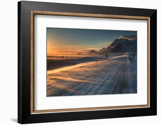 Snow Blows across an Icelandic Road at Sunrise with Mountains Looming in the Distance-Alex Saberi-Framed Photographic Print