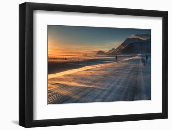 Snow Blows across an Icelandic Road at Sunrise with Mountains Looming in the Distance-Alex Saberi-Framed Photographic Print