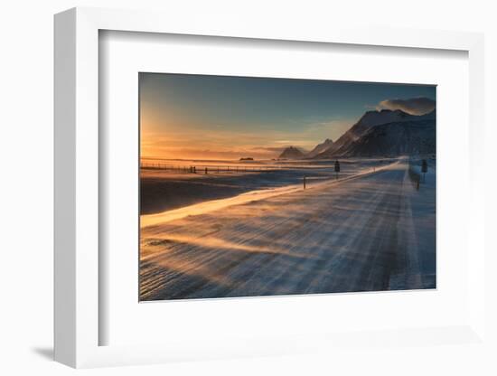 Snow Blows across an Icelandic Road at Sunrise with Mountains Looming in the Distance-Alex Saberi-Framed Photographic Print