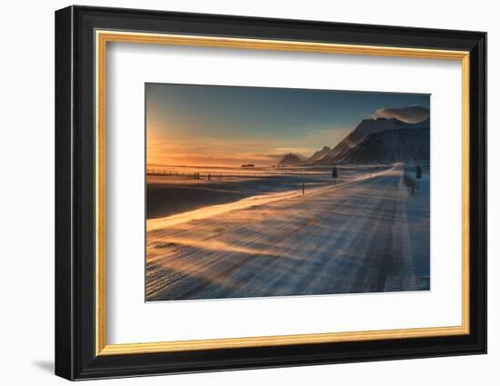 Snow Blows across an Icelandic Road at Sunrise with Mountains Looming in the Distance-Alex Saberi-Framed Photographic Print