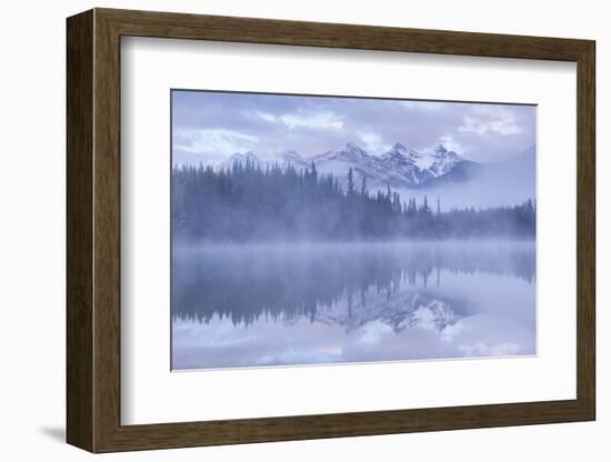 Snow capped mountains reflect in a misty Herbert Lake, Canadian Rockies, Banff National Park, Alber-Adam Burton-Framed Photographic Print