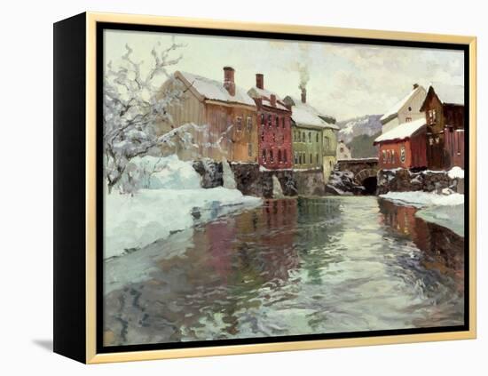 Snow-Covered Buildings by a River-Fritz Thaulow-Framed Premier Image Canvas