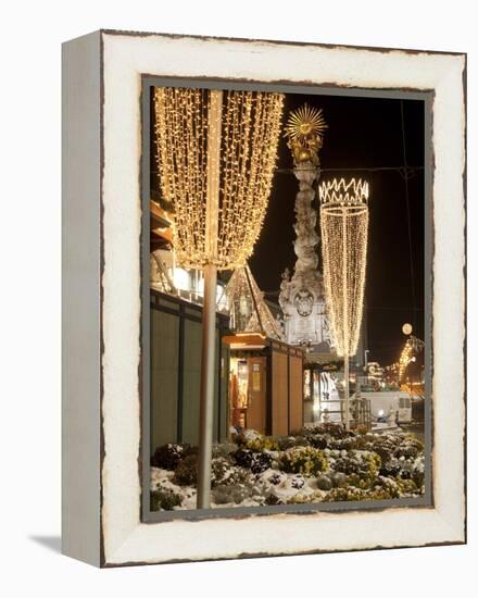 Snow-Covered Flowers, Christmas Decorations and Baroque Trinity Column at Christmas Market, Austria-Richard Nebesky-Framed Premier Image Canvas