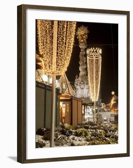 Snow-Covered Flowers, Christmas Decorations and Baroque Trinity Column at Christmas Market, Austria-Richard Nebesky-Framed Photographic Print