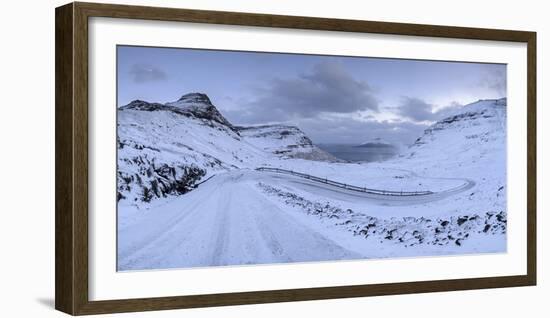 Snow covered mountain road on the Island of Streymoy, Faroe Islands, Denmark, Europe. Winter (March-Adam Burton-Framed Photographic Print