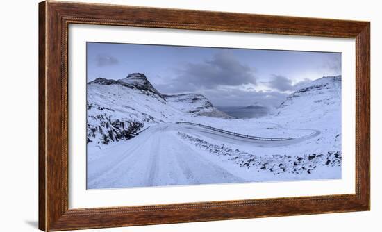 Snow covered mountain road on the Island of Streymoy, Faroe Islands, Denmark, Europe. Winter (March-Adam Burton-Framed Photographic Print