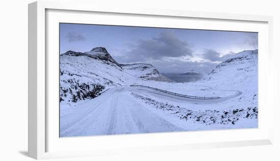 Snow covered mountain road on the Island of Streymoy, Faroe Islands, Denmark, Europe. Winter (March-Adam Burton-Framed Photographic Print