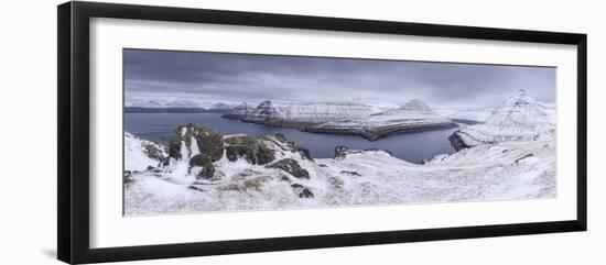 Snow covered mountain scenery above Funningsfjørdur on the island of Eysturoy, Faroe Islands, Denma-Adam Burton-Framed Photographic Print