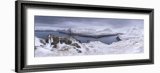 Snow covered mountain scenery above Funningsfjørdur on the island of Eysturoy, Faroe Islands, Denma-Adam Burton-Framed Photographic Print