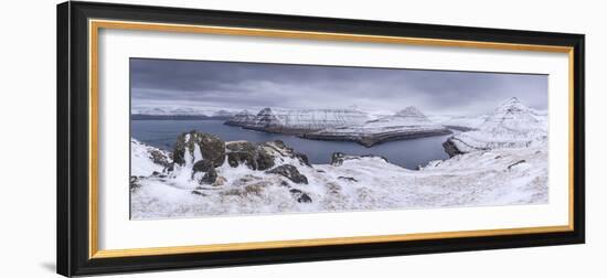 Snow covered mountain scenery above Funningsfjørdur on the island of Eysturoy, Faroe Islands, Denma-Adam Burton-Framed Photographic Print