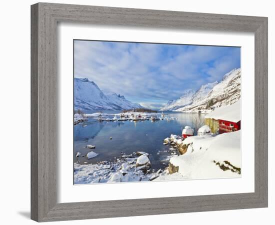 Snow Covered Mountains, Boathouse and Moorings in Norwegian Fjord Village of Ersfjord, Kvaloya Isla-Neale Clark-Framed Photographic Print