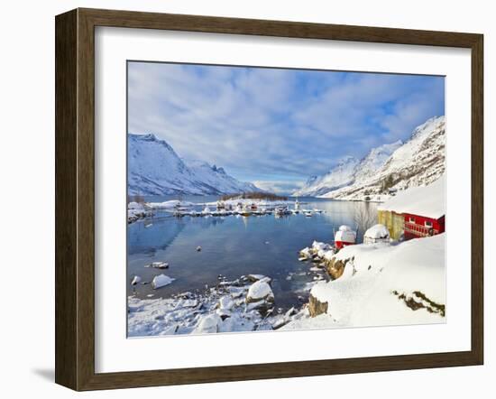 Snow Covered Mountains, Boathouse and Moorings in Norwegian Fjord Village of Ersfjord, Kvaloya Isla-Neale Clark-Framed Photographic Print