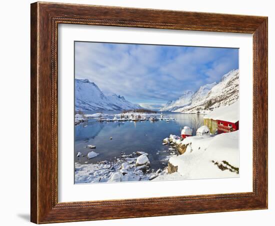 Snow Covered Mountains, Boathouse and Moorings in Norwegian Fjord Village of Ersfjord, Kvaloya Isla-Neale Clark-Framed Photographic Print