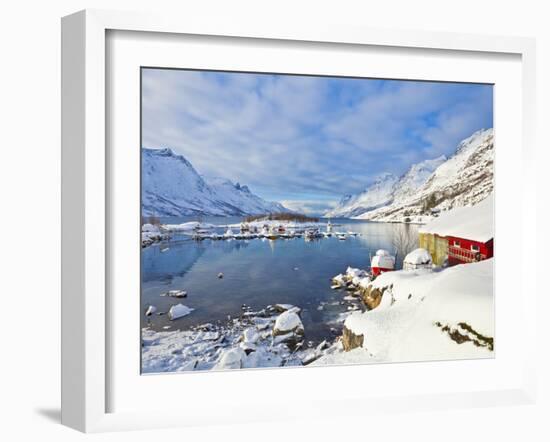 Snow Covered Mountains, Boathouse and Moorings in Norwegian Fjord Village of Ersfjord, Kvaloya Isla-Neale Clark-Framed Photographic Print