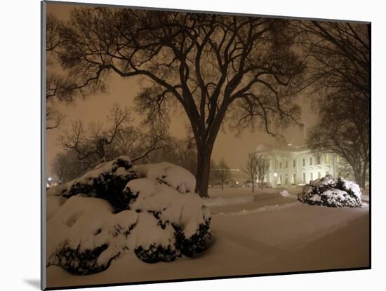 Snow Covers the Lawn in Front of the White House in Washington-null-Mounted Photographic Print