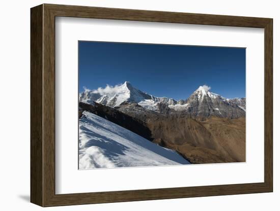 Snow on the Nyile La, a 4950m pass, and the peak of Jitchu Drake at 6714m in the distance, Bhutan,-Alex Treadway-Framed Photographic Print