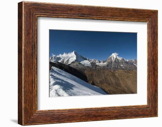 Snow on the Nyile La, a 4950m pass, and the peak of Jitchu Drake at 6714m in the distance, Bhutan,-Alex Treadway-Framed Photographic Print