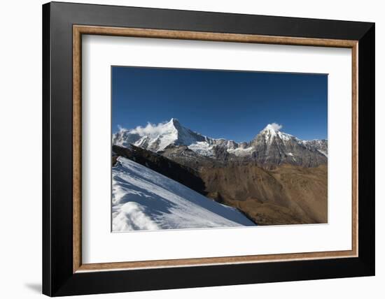 Snow on the Nyile La, a 4950m pass, and the peak of Jitchu Drake at 6714m in the distance, Bhutan,-Alex Treadway-Framed Photographic Print