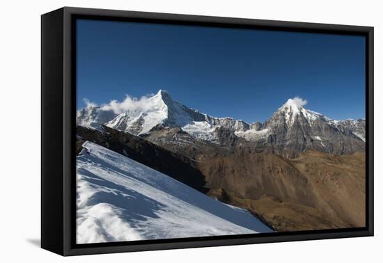 Snow on the Nyile La, a 4950m pass, and the peak of Jitchu Drake at 6714m in the distance, Bhutan,-Alex Treadway-Framed Premier Image Canvas