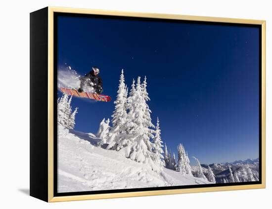 Snowboarding Action at Whitefish Mountain Resort in Whitefish, Montana, USA-Chuck Haney-Framed Premier Image Canvas