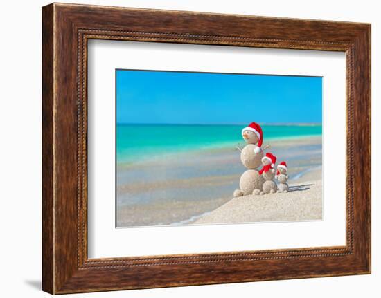 Snowmans Family at Sea Beach in Santa Hat. New Years and Christmas-EMprize-Framed Photographic Print