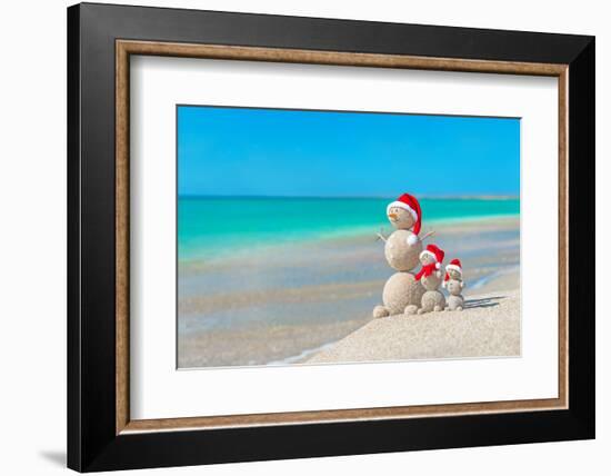 Snowmans Family at Sea Beach in Santa Hat. New Years and Christmas-EMprize-Framed Photographic Print