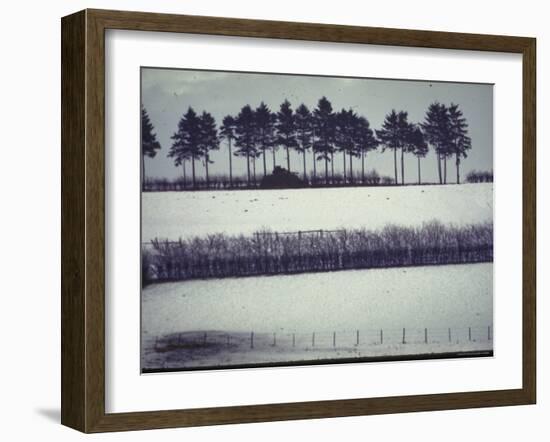 Snowy Landscape Frames Single American Tank Moving Along Distant Road During Battle of the Bulge-George Silk-Framed Photographic Print