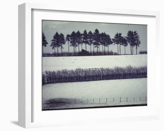 Snowy Landscape Frames Single American Tank Moving Along Distant Road During Battle of the Bulge-George Silk-Framed Photographic Print