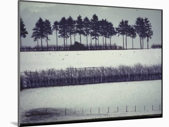 Snowy Landscape Frames Single American Tank Moving Along Distant Road During Battle of the Bulge-George Silk-Mounted Photographic Print