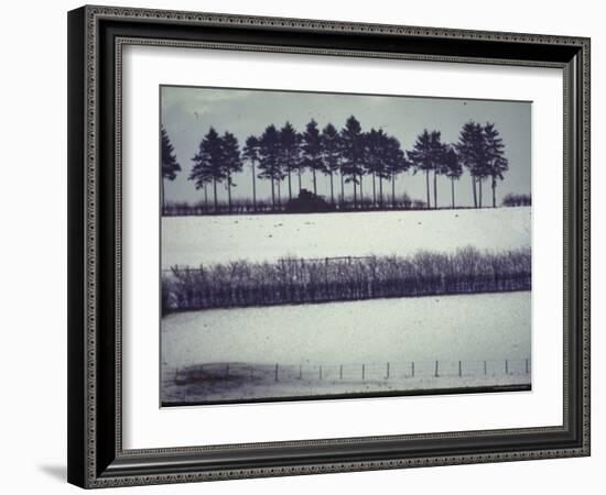 Snowy Landscape Frames Single American Tank Moving Along Distant Road During Battle of the Bulge-George Silk-Framed Photographic Print