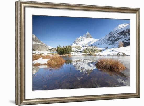 Snowy peaks are reflected in the alpine lake partially frozen, Lejets Crap Alv (Crap Alv Laiets), C-Roberto Moiola-Framed Photographic Print