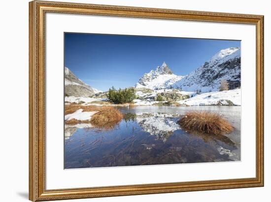 Snowy peaks are reflected in the alpine lake partially frozen, Lejets Crap Alv (Crap Alv Laiets), C-Roberto Moiola-Framed Photographic Print