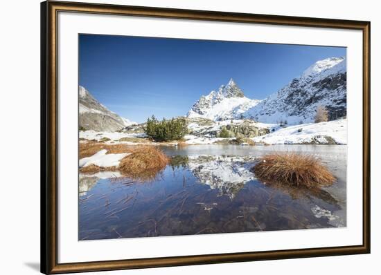 Snowy peaks are reflected in the alpine lake partially frozen, Lejets Crap Alv (Crap Alv Laiets), C-Roberto Moiola-Framed Photographic Print