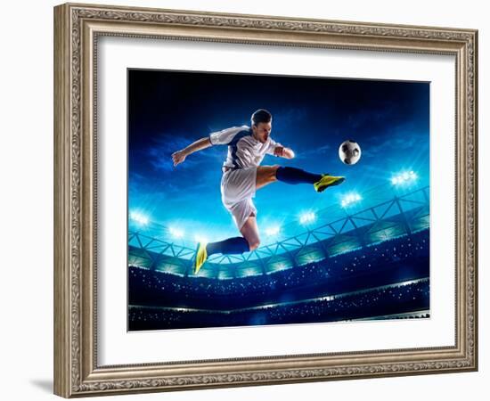 Soccer Player in Action on Night Stadium Background-Eugene Onischenko-Framed Photographic Print