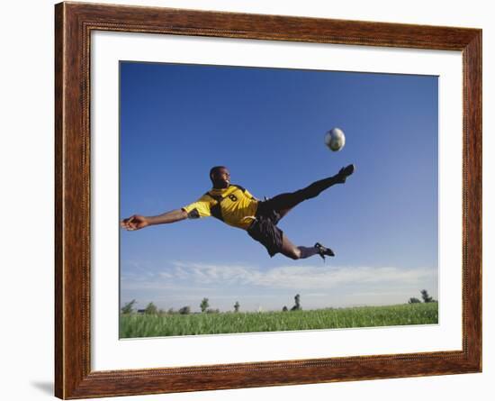 Soccer Player in Action-null-Framed Photographic Print