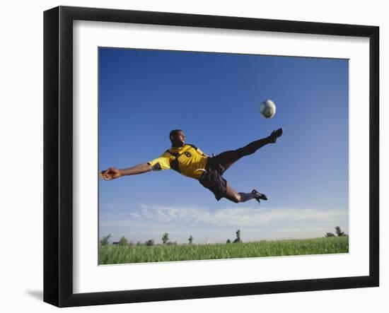 Soccer Player in Action-null-Framed Photographic Print