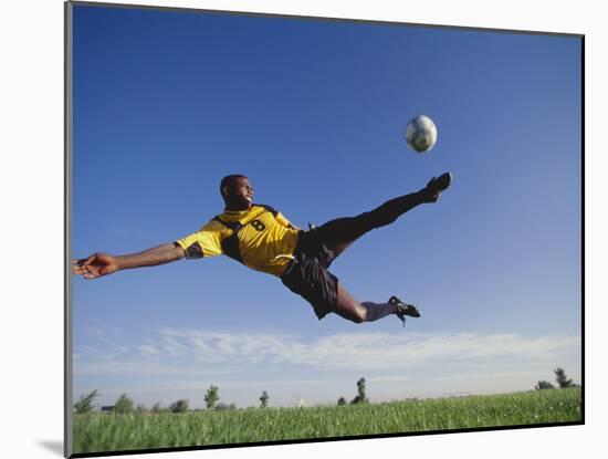 Soccer Player in Action-null-Mounted Photographic Print