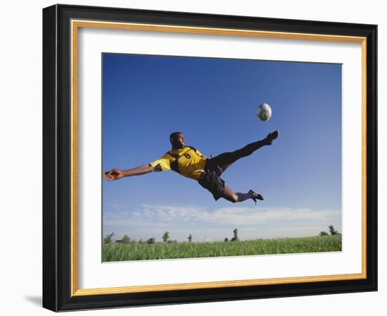 Soccer Player in Action-null-Framed Photographic Print