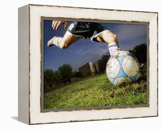 Soccer Player Kicking Ball-Randy Faris-Framed Premier Image Canvas